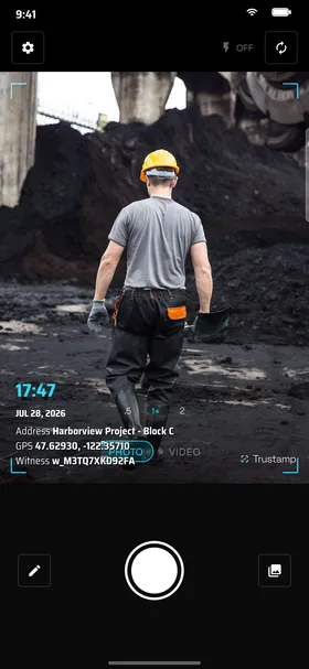Trustamp camera capturing a construction worker on a job site with a live time, date, GPS address and witness code watermark